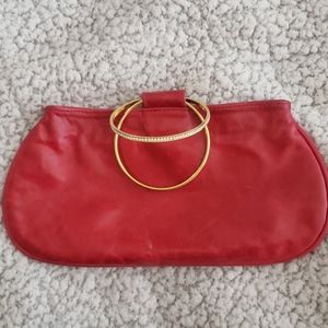 Kjo Red wristlet clutch with gold bracelet